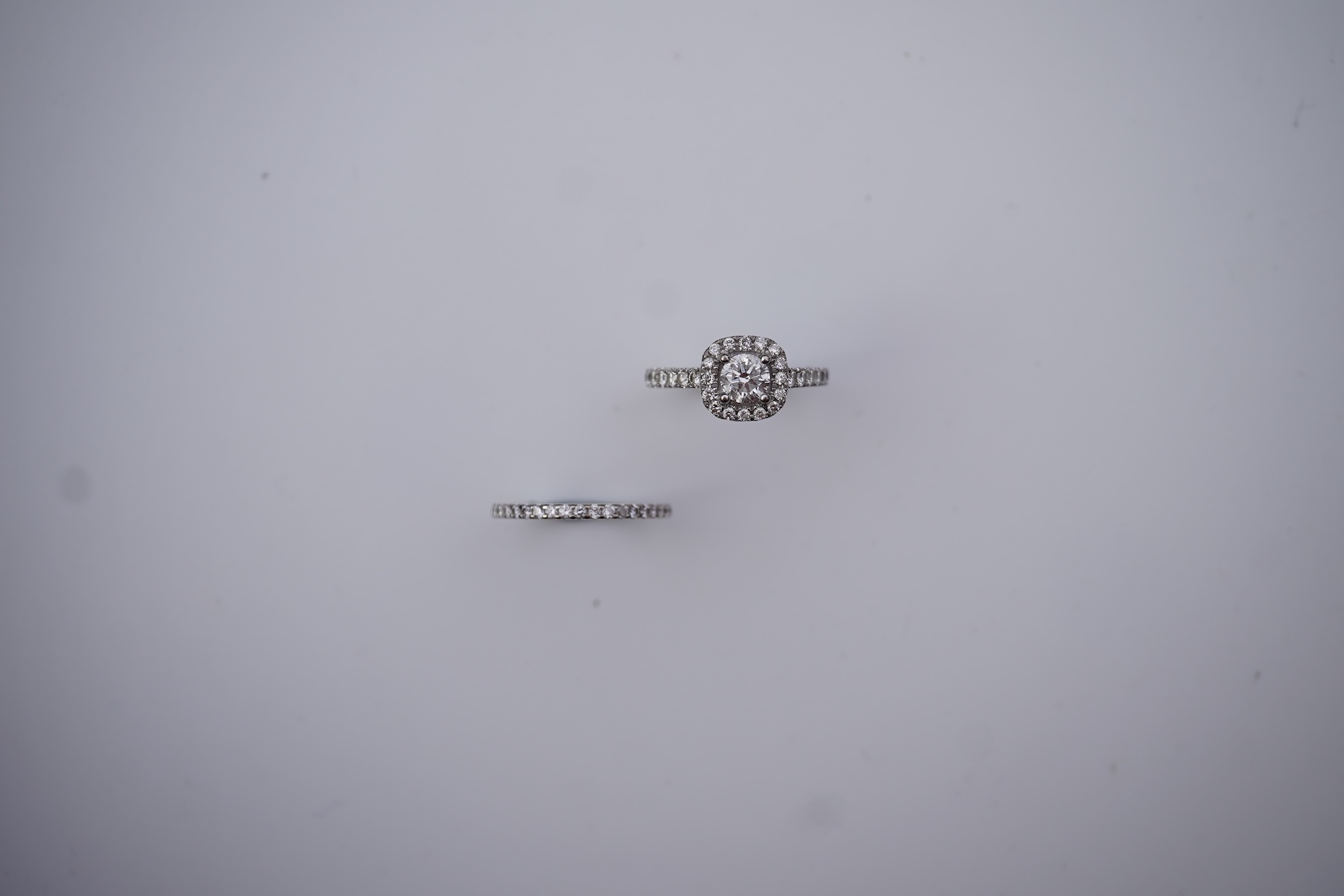 A diamond engagement ring and half eternity ring